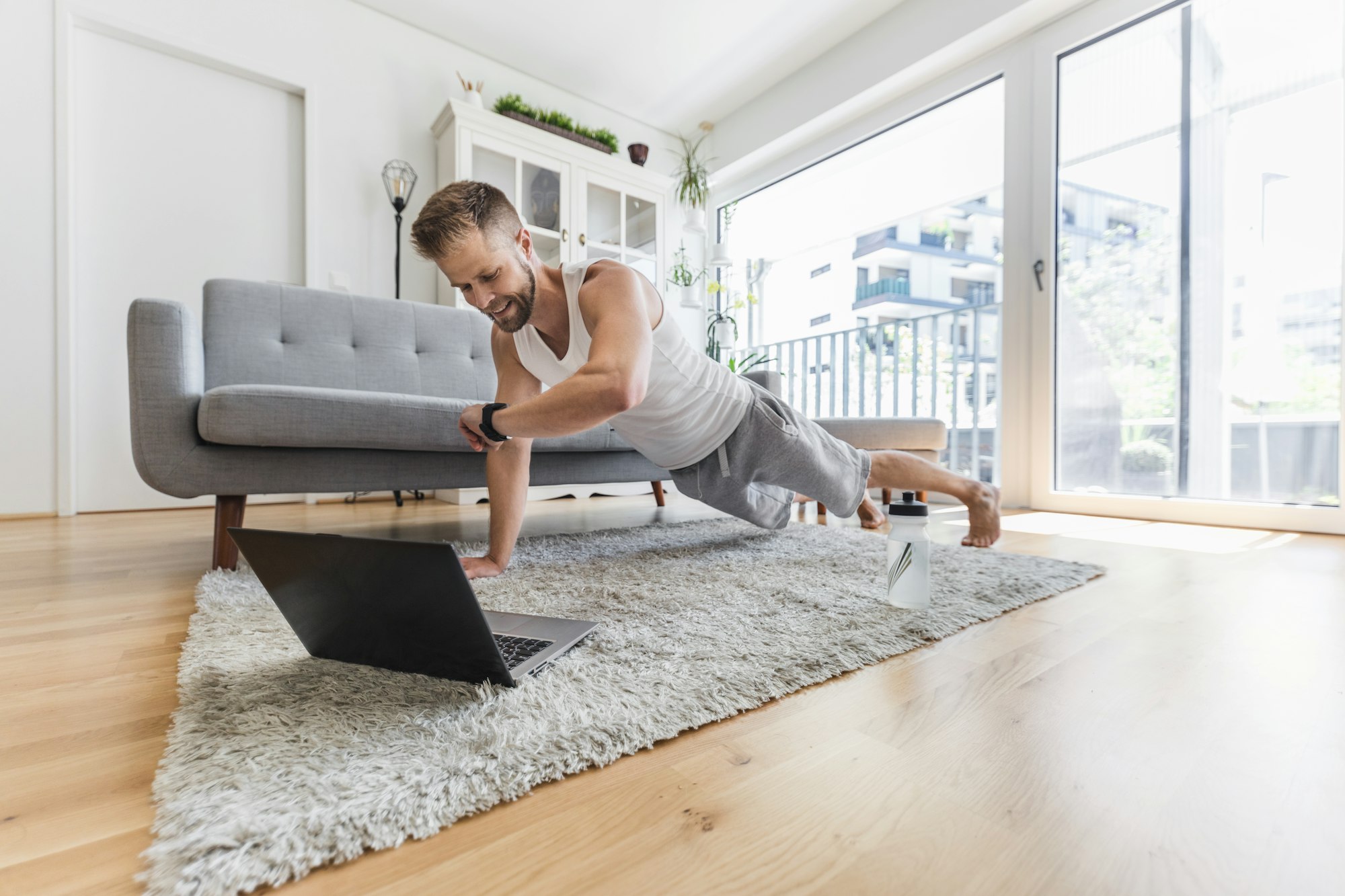 Handsome man working out at home