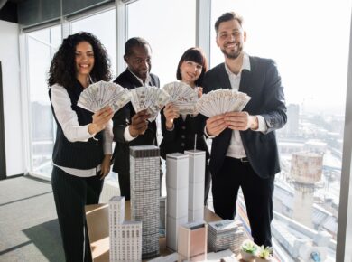 Team of diverse multiethnic business people holding bundle of american dollar cash money